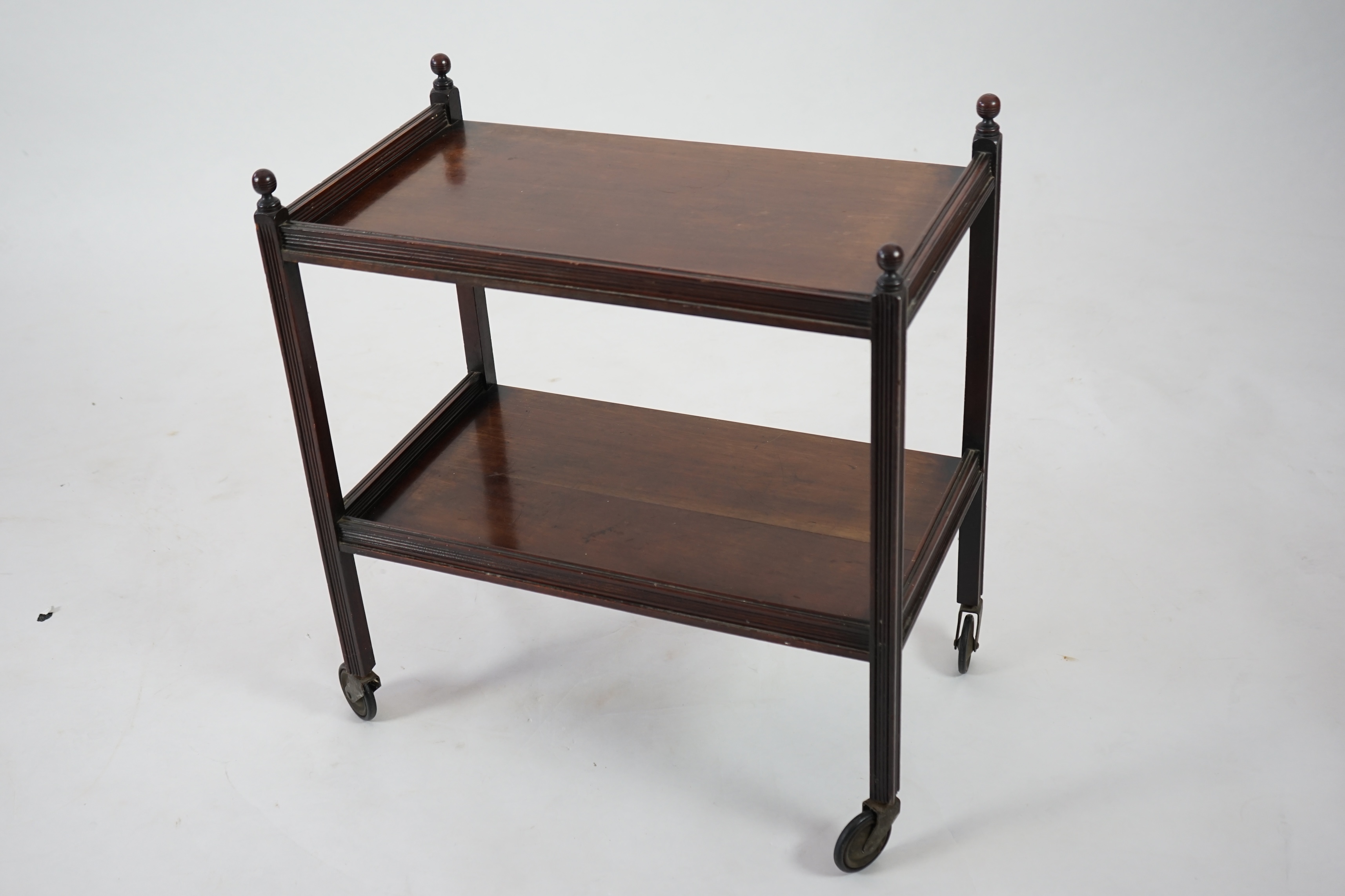 An Edwardian mahogany two tier trolley